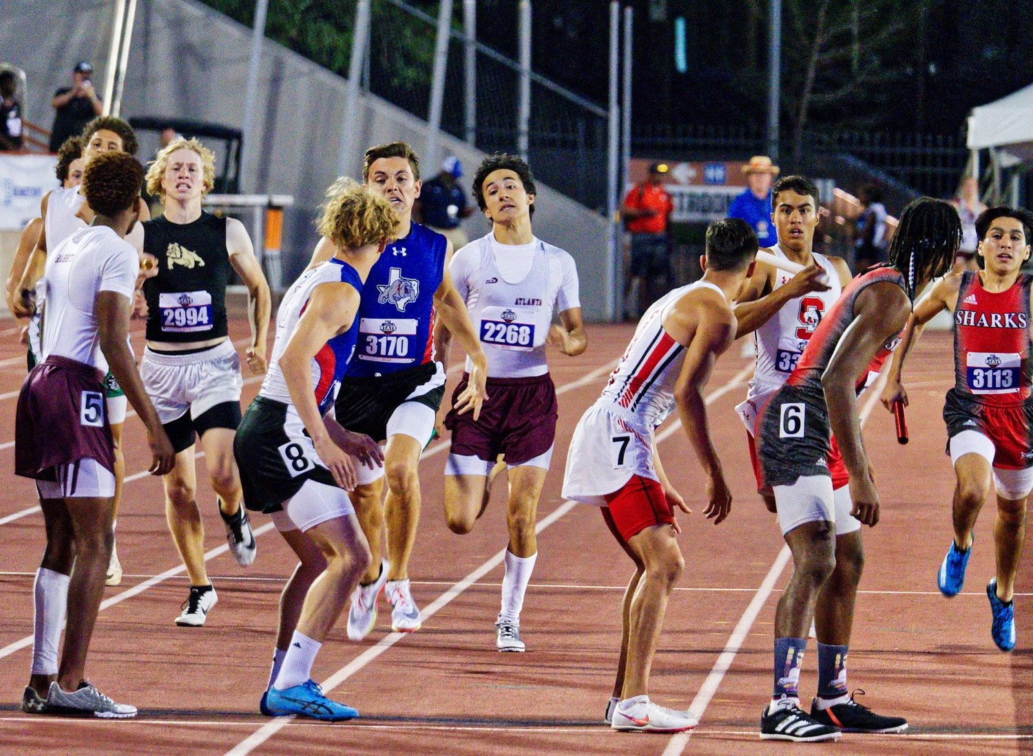 Brandon Jimenez hands the lead off the Jack Tannebaum in the 4x400 relay. [see more sprinters, soarers]